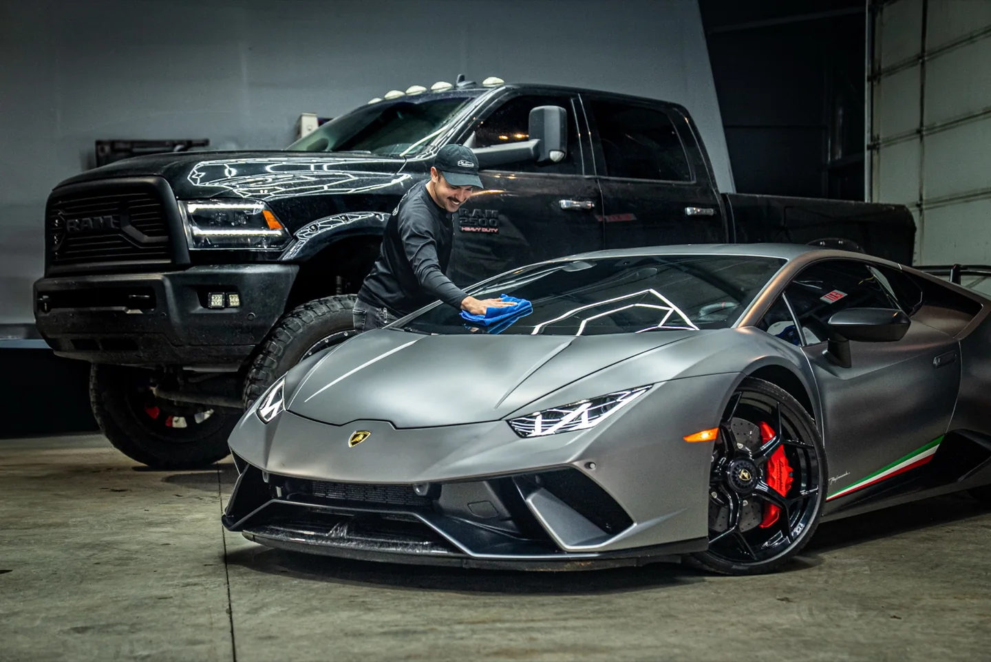 Platinum Auto Care technician hand-finishing a Lamborghini Huracan Performante in the Portland studio